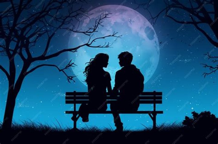a man and woman sitting next to each other on a window sill