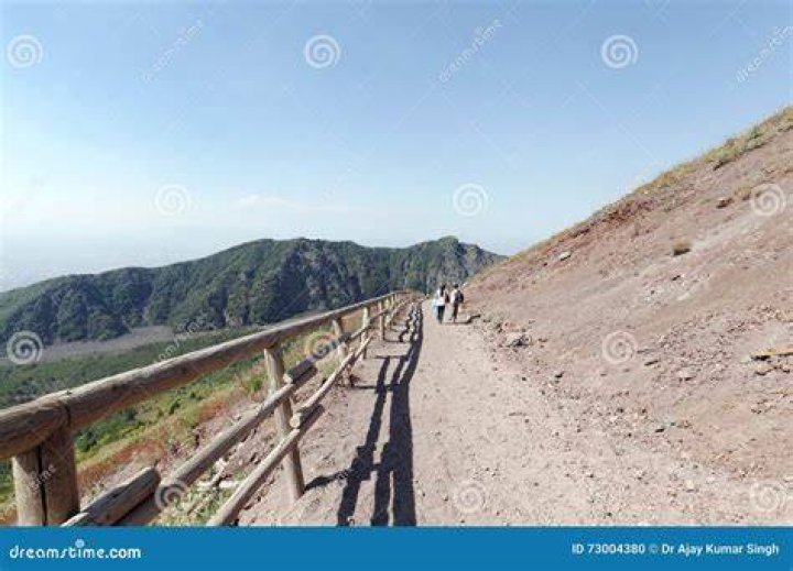 A tourist visiting Mount Vesuvius dropped his phone. Then he fell into