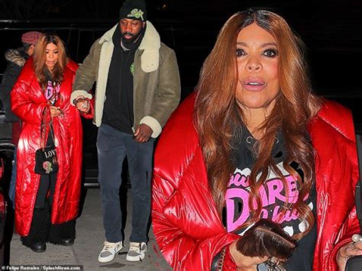 Wendy Williams, 58, holds onto the hand of handsome younger man and